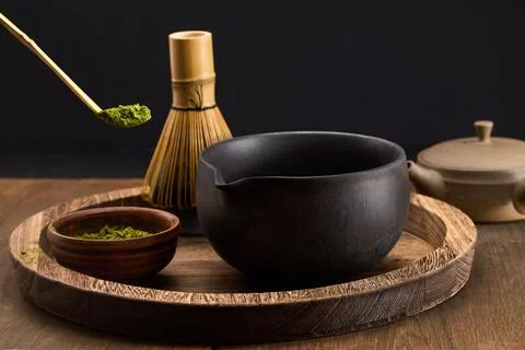Traditional Matcha Setup. Elegant matcha tea set with vibrant green powder, bowl Stock Photos