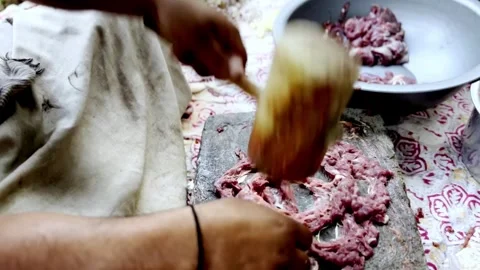 Traditional Meat Preparation by Beating Meat on Stone Видео 339530825