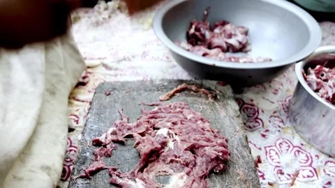 Traditional Meat Preparation by Beating Meat on Stone Vidéo 339530993