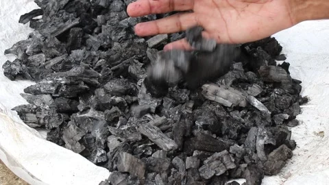 Traditional method of preserving charcoal for later use Video stock 335227501