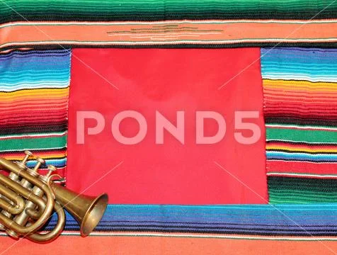 Traditional Mexican fiesta poncho rug in bright colors with sombrero backgro Stock Photos