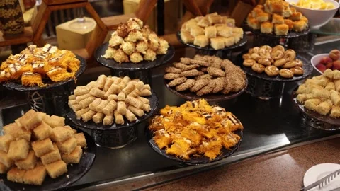 Traditional Middle Eastern dessert buffet with assorted pastries including bakla Stock Footage 310536985