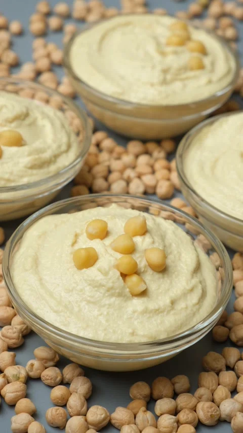 Traditional middle eastern hummus dip in glass bowls. Stock Footage 332658074