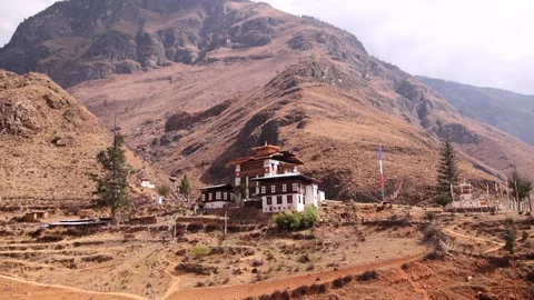 Traditional monastery below Bhutan Himalayan mountain Stock-Footage 344186906