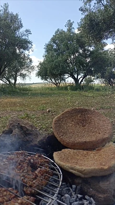 Traditional Moroccan Barley Bread Cooking on Outdoor Grill in Rural Nature. Stock Footage 334580679