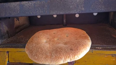 Traditional Moroccan Bread Baking in Oven. Stock Footage 341757106