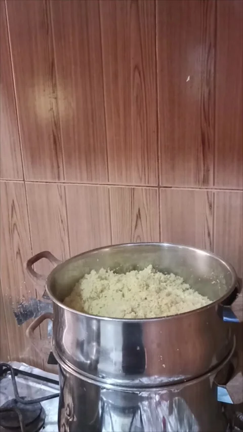 Traditional Moroccan Couscous Steaming Process in Stainless Steel Pot Stock Footage 333865680