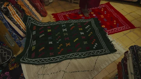 Traditional Moroccan Rugs with Berber Patterns Displayed in Shop Stock Footage 336406791