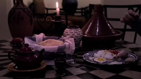 Traditional Moroccan table setting, featuring Terracotta tagine, bread, cak.. Stock Footage 335392130