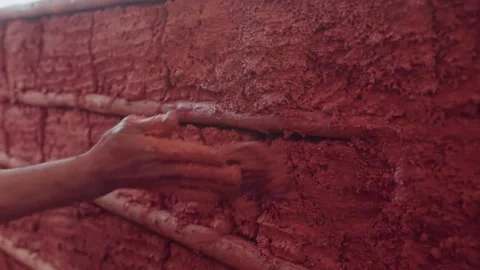 Traditional mud wall construction with natural building materials Stock Footage 345682311