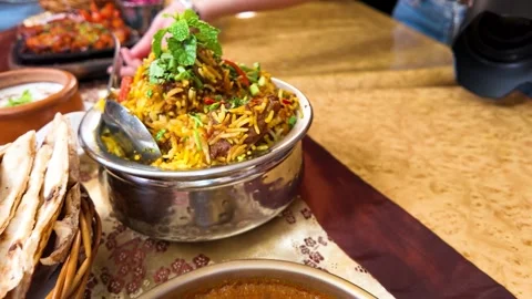 Traditional Mutton Biryani and Lamb Curry Served in a Bangkok Restaurant Stock Footage 342779264