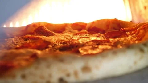 Traditional Neapolitan Pizza Baking in an Authentic Wood-Fired Brick Oven Stock Footage 337676799