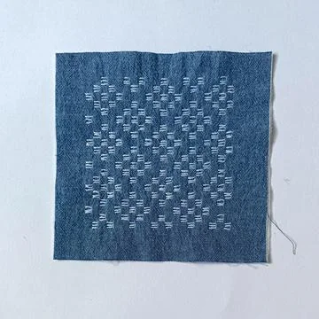 Traditional Needlework Sample with Geometric Hitomezashi Design.  Stock Photos
