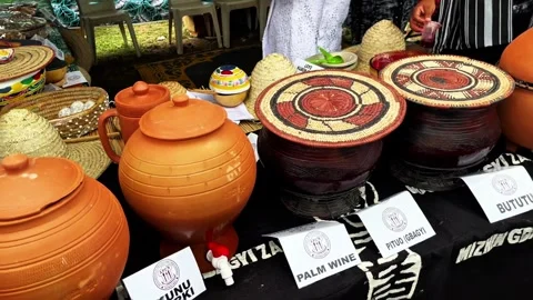 Traditional Nigerian Drinks Displayed in Clay Pots at Outdoor Event Video stock 337605087