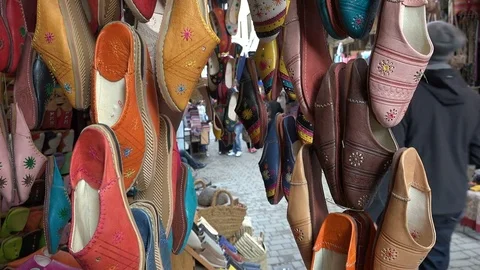 Traditional North African (Moroccan) slippers for sale in the medina of Fez Stock Footage