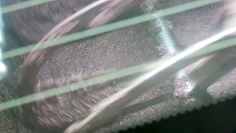 Traditional olive oil processing with crushing the olives into a paste Stock Footage 124313624