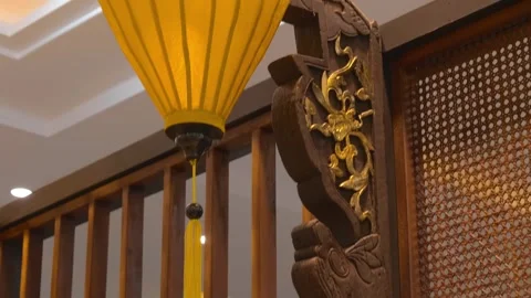 A traditional orange Vietnamese silk lantern made with bamboo and fabric Stock Footage 340628098