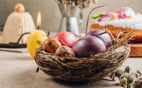 Traditional Ortodox Easter background. Easter eggs in a nest on a stone bac.. Stock Photos