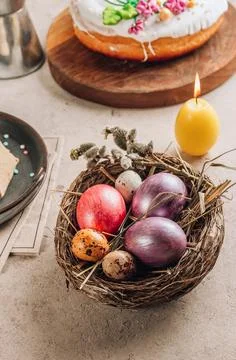 Traditional Ortodox Easter background. Easter eggs in a nest on a stone bac.. Stock Photos