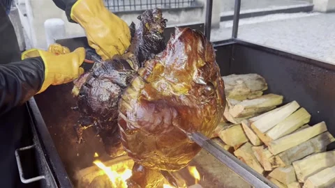 Traditional Outdoor Spit-Roasting of a Pig. Stock Footage 265755299