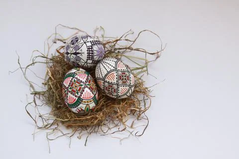 Traditional painted handmade Easter eggs on hay Stock Photos