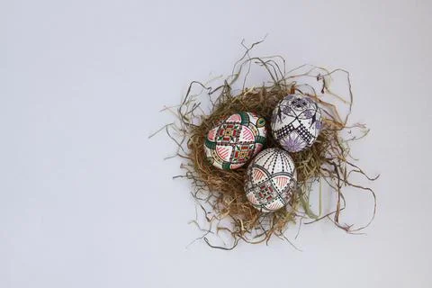 Traditional painted handmade Easter eggs on hay Stock Photos