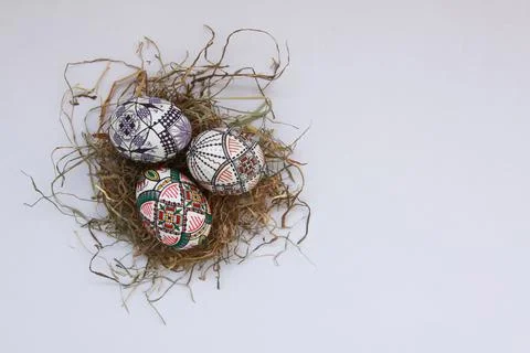 Traditional painted handmade Easter eggs on hay Stock Photos