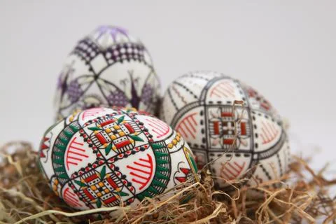 Traditional painted handmade Easter eggs on hay Stock Photos