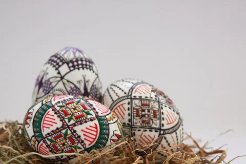 Traditional painted handmade Easter eggs on hay Stock Photos