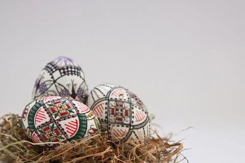 Traditional painted handmade Easter eggs on hay Stock Photos