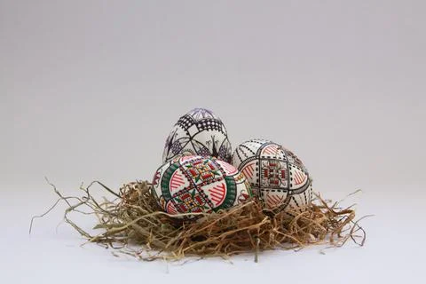 Traditional painted handmade Easter eggs on hay Stock Photos