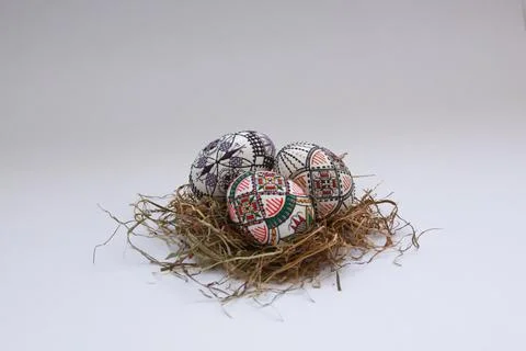 Traditional painted handmade Easter eggs on hay Stock Photos