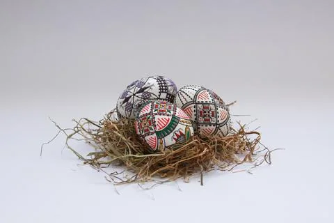 Traditional painted handmade Easter eggs on hay Stock Photos