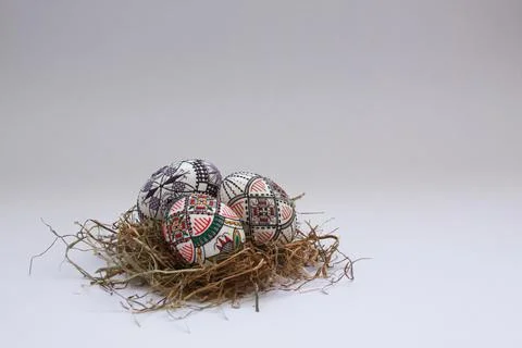 Traditional painted handmade Easter eggs on hay Stock Photos