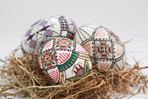 Traditional painted handmade Easter eggs on hay Stock Photos