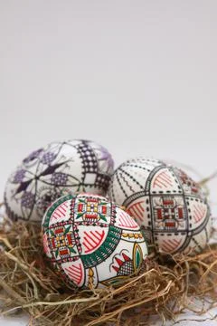 Traditional painted handmade Easter eggs on hay Stock Photos