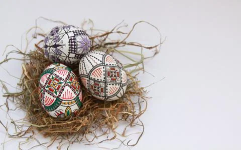 Traditional painted handmade Easter eggs on hay Stock Photos
