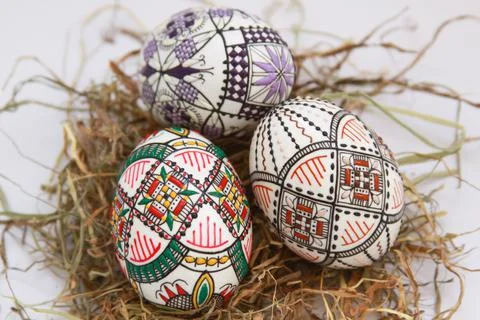 Traditional painted handmade Easter eggs on hay Stock Photos