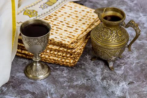 Traditional Passover Seder table setting with matzah, wine cup at Jewish Holiday Stock Photos