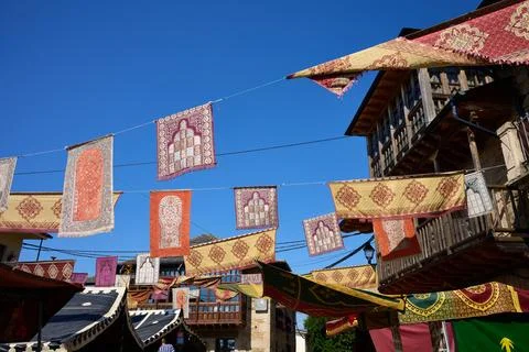 Traditional patterned carpets decorating a festive street scene Stock Photos