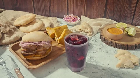 Traditional Peruvian Breakfast with Chicharron Pork Sandwich and Tamale Video stock 341439723