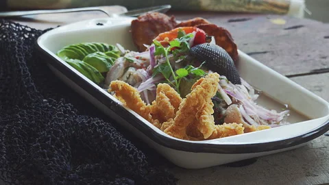 Traditional Peruvian Ceviche with corn and sheet potatoe with Cold Beer Stock Footage 338341235