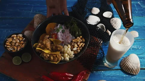 Traditional Peruvian ceviche served with fried calamari, sweet potato, and beer. Video stock 339078153