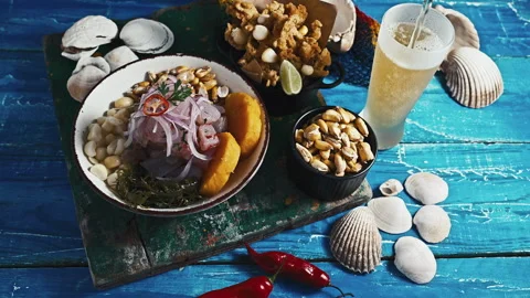 Traditional Peruvian ceviche served with fried calamari and cold beer. Stock Footage 339078169