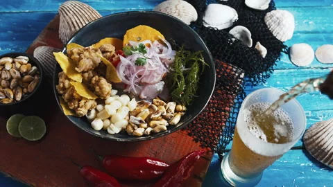 Traditional Peruvian ceviche served with fried calamari, sweet potato, and beer. Video stock 339078265