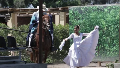 Traditional Peruvian dance, Peruvian man on a horse, a woman in a white dress Vídeo Stock 236938689