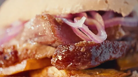 Traditional Peruvian Pan con Chicharron Pork Sandwich with Sweet Potato Stock Footage 338341333