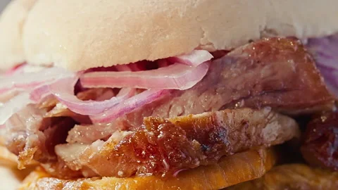Traditional Peruvian Pan con Chicharron Pork Sandwich with Sweet Potato Video stock 341438182