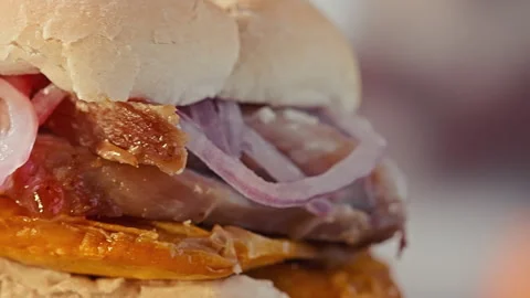 Traditional Peruvian Pan con Chicharron Pork Sandwich with Sweet Potato Stock Footage 341438187
