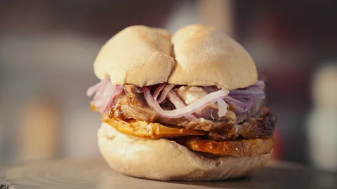 Traditional Peruvian Pan con Chicharron Pork Sandwich with Sweet Potato Stock Footage 341438206